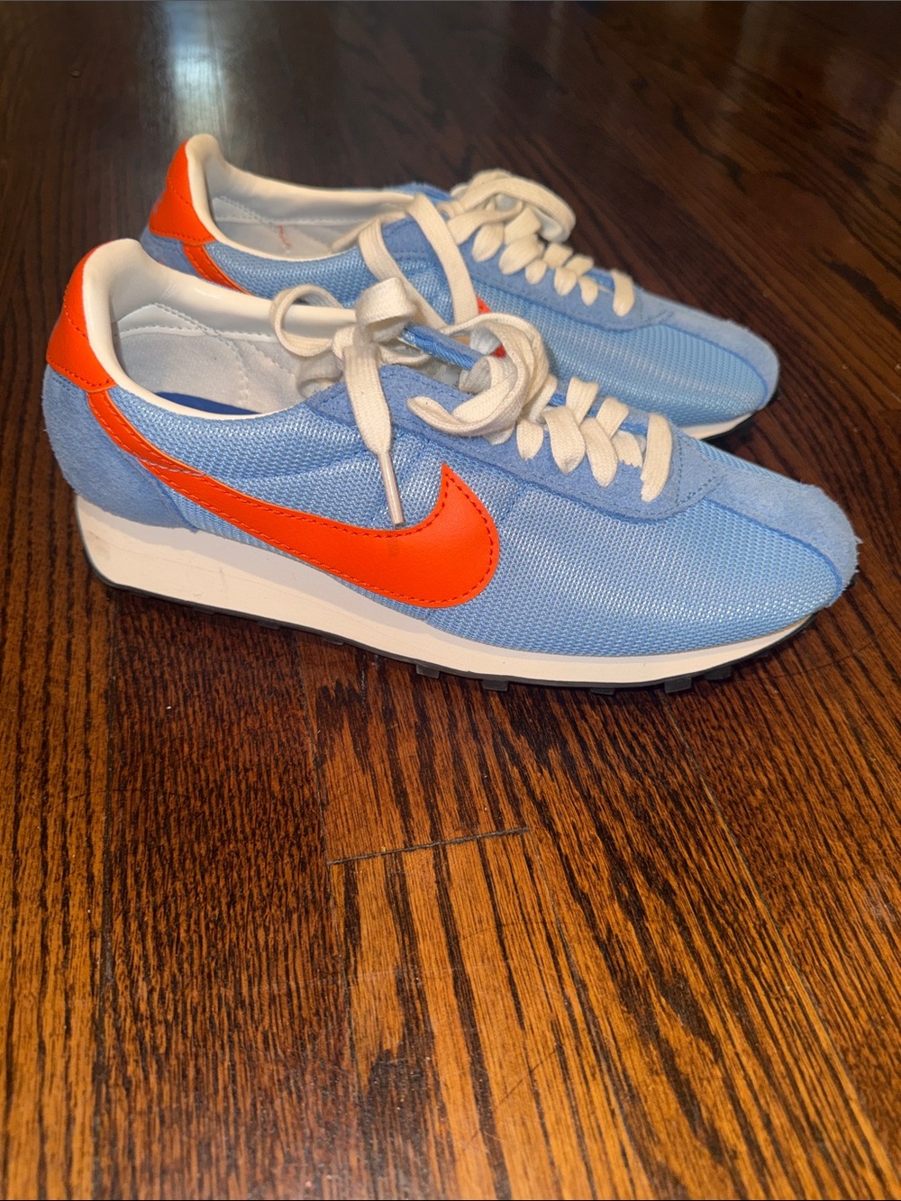 Nike womens Light Blue Sneakers with Orange Swoosh- size 8- never worn